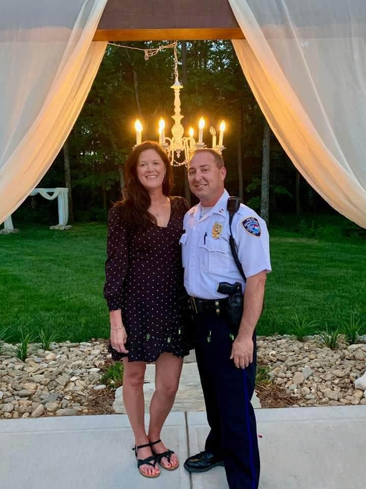Woman Taking a Picture With a Police Officer