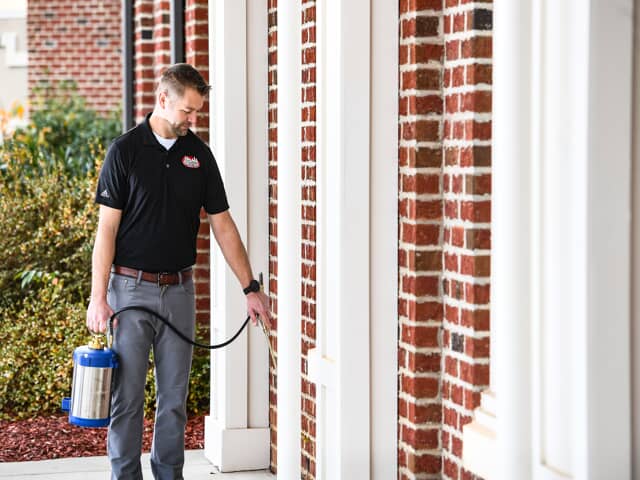 Man Spraying Home